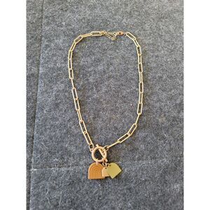 Unique Gold tone Paperclip necklace with rainbow arch charms, in good condition
